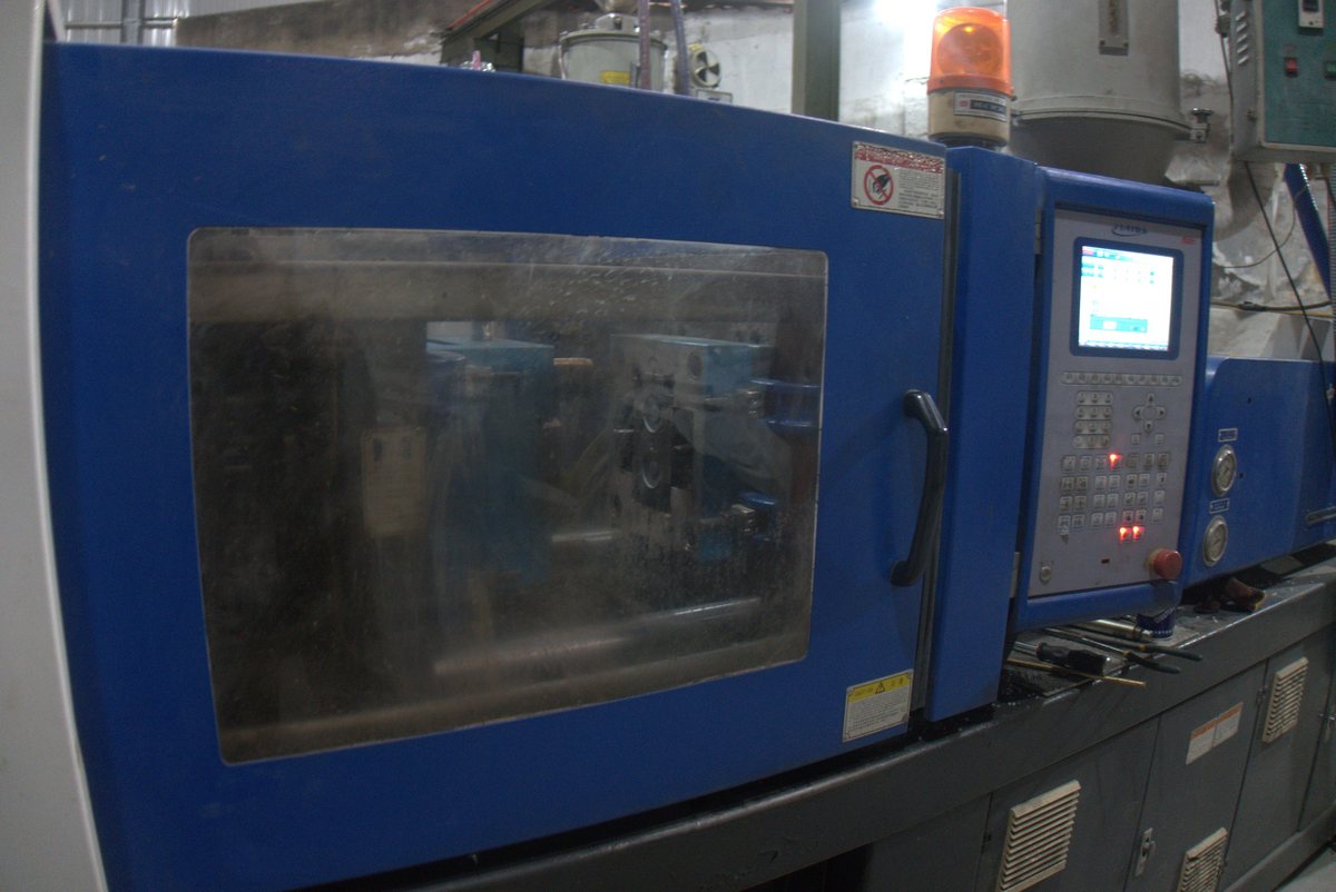 Injection-moulding machine producing pram frames and fittings